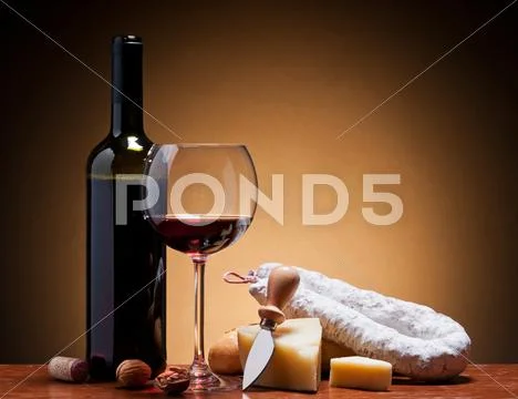 Wine, hard cheese and salami Stock Photos