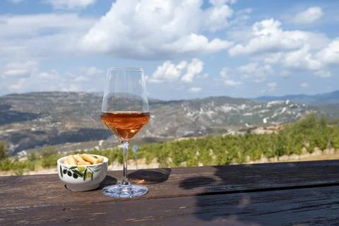 Wine industry of Cyprus island, tasting of rose dry wine on winery with view  Stock Photos