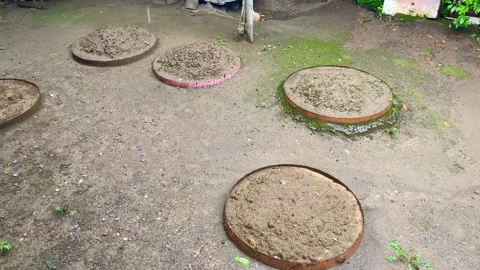 Wine jars with wine fermentation underground in local georgian courtyard in t Видео 201203012