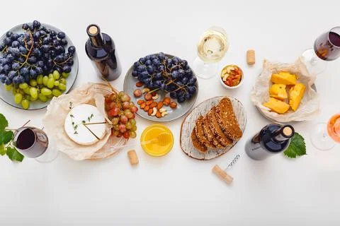 Wine party event dinner table with set cheese grapes honey nuts. Festive table Stock Photos
