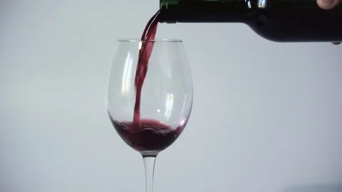 Wine is poured into a empty glass from a bottle. Close-up Stock Footage 105894368