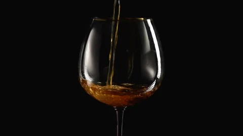 Wine is poured into a glass. Video stock 217840990