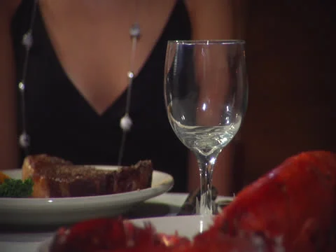 Wine poured into glass at table for dinner, static Video stock 26234003