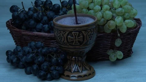 Wine is pouring into clay cup 스톡 동영상 80634692