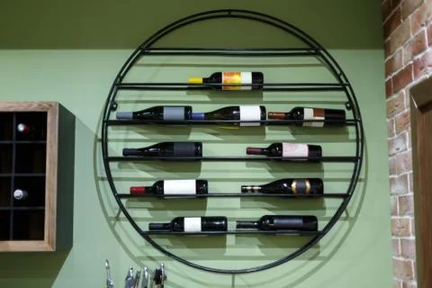 Wine rack with bottles of wine in the interior. Stock Photos