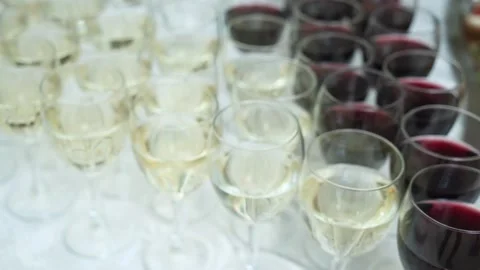 Wine. Row of wine glasses with poured alcohol at party banquet. close-up. Vídeo Stock 203982989