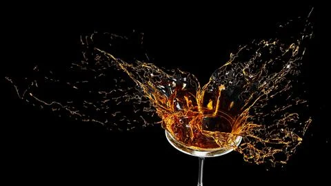WINE SPLASH BLACK BACKGROUND Stock Photos