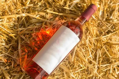 Wine on straw Stock Photos