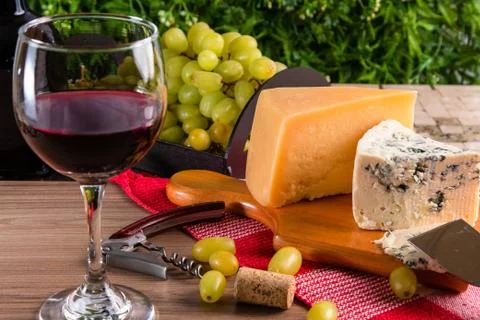 Wine table with cheese and grapes Stock Photos