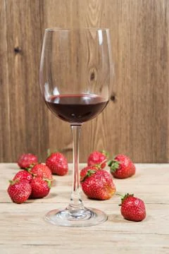 Wine on the table with strawberries Stock Photos