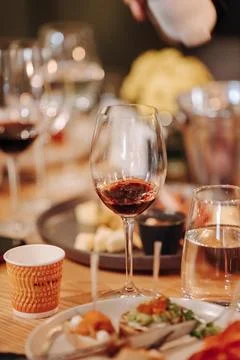 Wine tasting experience in the rustic cellar and wine bar: red wine glass and Stock Photos