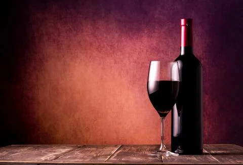 Wine on textured background Stock Photos