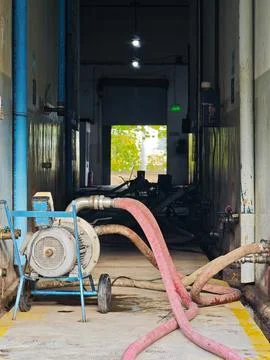 Wine transfer process: Industrial pump and hoses moving wine in a Mendoza w.. 写真素材