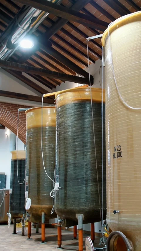 Wine warehouse. winery. Large wine vats inside the winery. Large tanks or Stock Footage 323093443