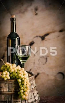 Wine on the wooden barrels. Stock Photos