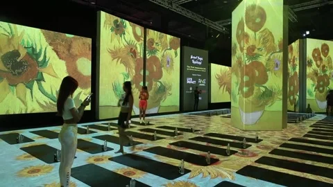 Wine Yoga excercise at immersive Van Gogh Alive art exhibition Bangkok, THAILAND Stock Footage 247354451