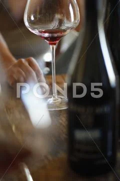 Wineglasses and wine bottles on a wood table at a wine tasting Stock Photos