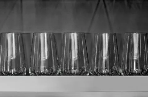 Wineglasses on grey background. Stock Photos