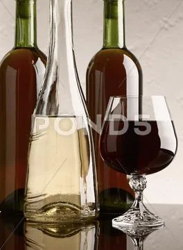 Winery still life on the glass with red and white wine Stock Photos
