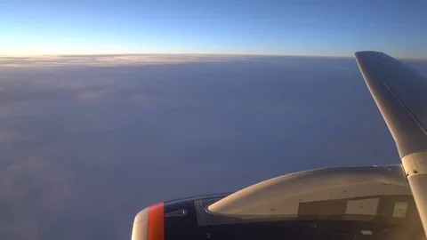 The wing of the aircraft and part of the engine are visible in the airplane Stock Footage 83255160