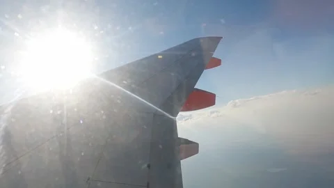 The wing of an aircraft in the sky with clouds. Stock Footage 312063648