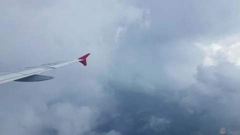 Wing of an airplane in cloudy weather Stock Footage 264939293
