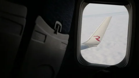 Wing of an airplane flying above the cloud. View from the window of the plane. Stock Footage 120566288