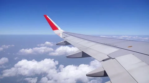 Wing of an Airplane Flying Above the Clouds. Stock-Footage 49478675