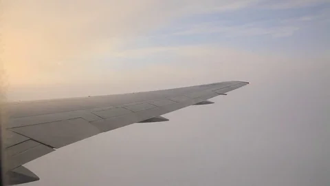 Wing of an airplane flying above the clouds. Stock-Footage 70228543