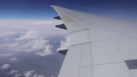 Wing of airplane flying above clouds 4k for background Stock Footage 108435829