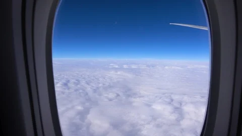 The wing of an airplane flying above the clouds, the view from the window 스톡 동영상 125240343