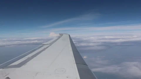 Wing of an airplane flying above the clouds. Stock Footage 128741877