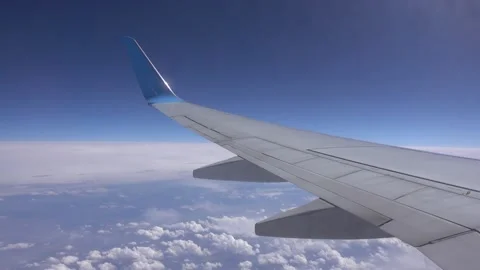The wing of an airplane flying above the clouds. Stock Footage 160350916