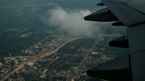 Wing of an airplane flying above the clouds. View from the window of the plane Stock Footage 169794306