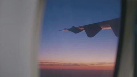Wing Of An Airplane Flying Above The Clouds Stock Footage 169872010