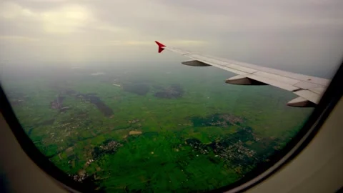 Wing of an airplane flying above clouds Video stock 313652821