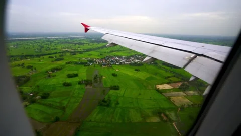 Wing of an airplane flying above clouds Stock Footage 313652857