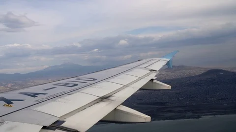 Wing Of An Airplane Flying Mountains Stock Footage 105037733