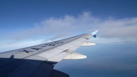 Wing Of An Airplane Flying over Clouds Stock Footage 105036837