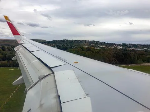Wing of an airplane flying over the clouds Stock-Fotos