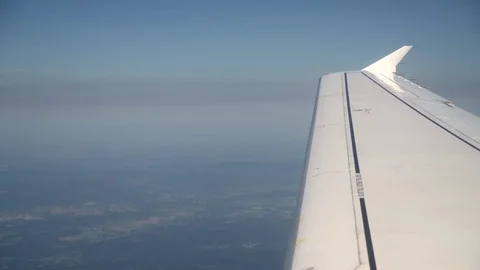 Wing of a airplane. Flying over mountains Stock Footage