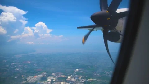 Wing of an airplane flying through the blue sky. 库存影片 83064494