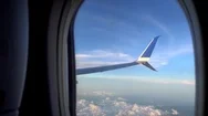 The Wing Of An Airplane Looking Through The Passenger Window. Stock Footage