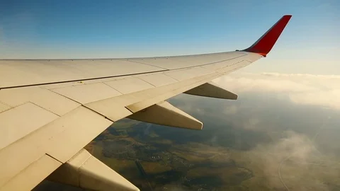Wing of an airplane in the sky Stock Footage 94976494