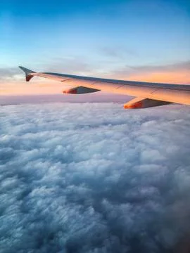 Wing of an Airplane at Sunset Stock Photos