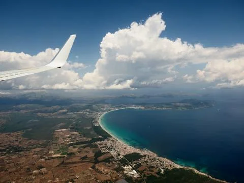 Wing of airplane from window Stock Photos