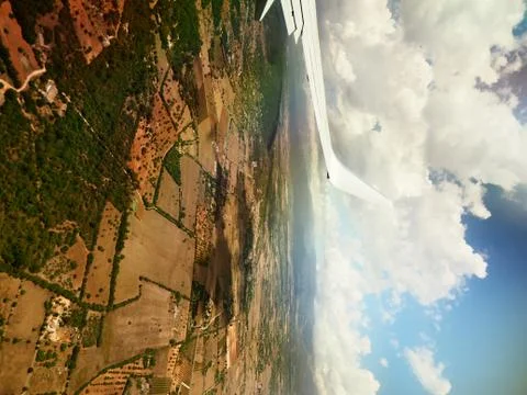 Wing of airplane from window Stock Photos