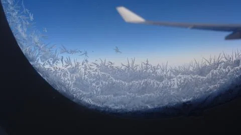 Wing of an airplane from the window in the sky Foto stock