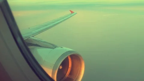 Wing and engine airplane flying on cloud and sky background Видео 89134388