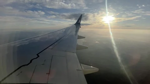 Wing and sky view from airplane window 動画素材 251884343